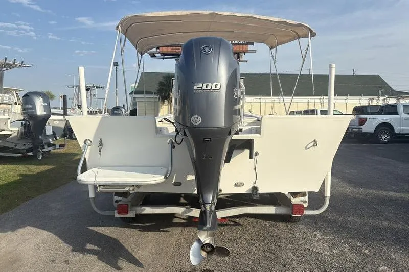 Slide: The Image of Rear view of a 2014 Reno 23 boat with a 200 HP outboard motor. - 2