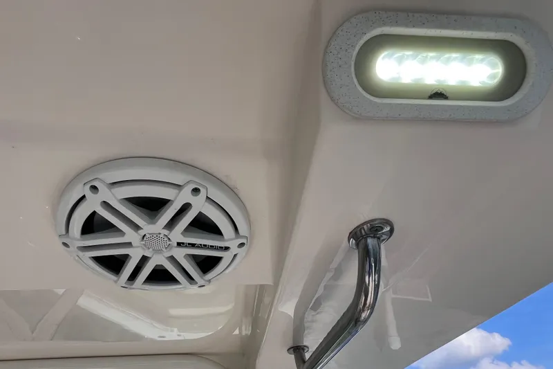 Slide: The Image of 2019 Scout 275 LXF boat interior with JL Audio speaker and LED light. - 31