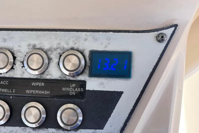Slide: The Image of Control panel of a 2019 Scout 275 LXF boat with digital display reading 13.21 volts. - 45