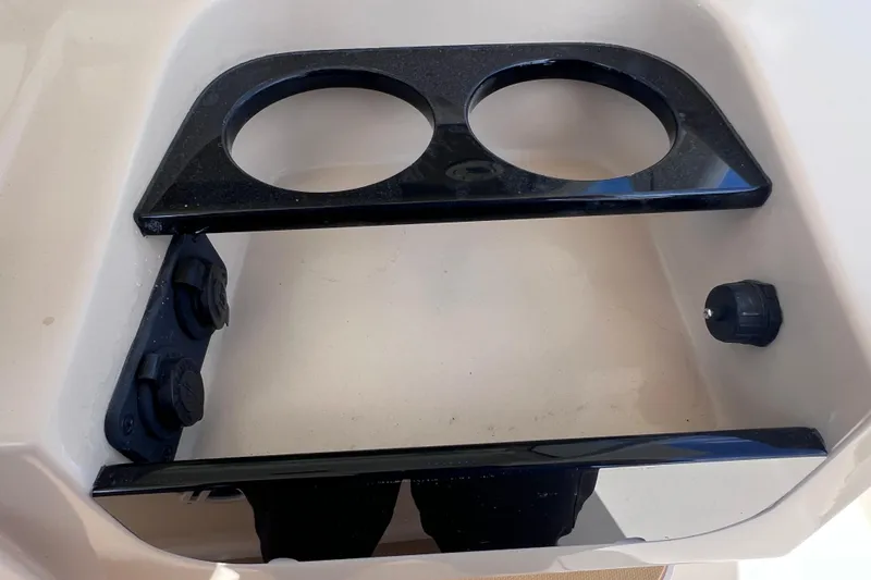 Slide: The Image of 2019 Scout 275 LXF boat cup holders and power outlets. - 47