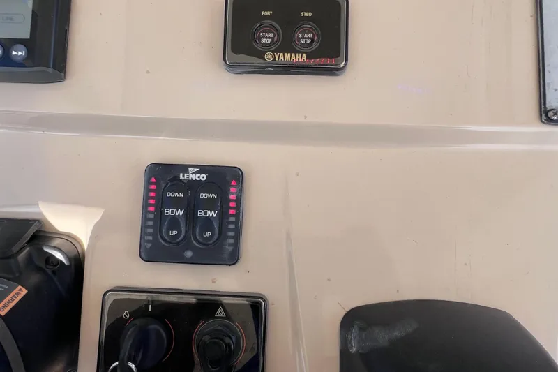 Slide: The Image of Control panel of a 2019 Scout 275 LXF boat featuring Lenco and Yamaha systems. - 48