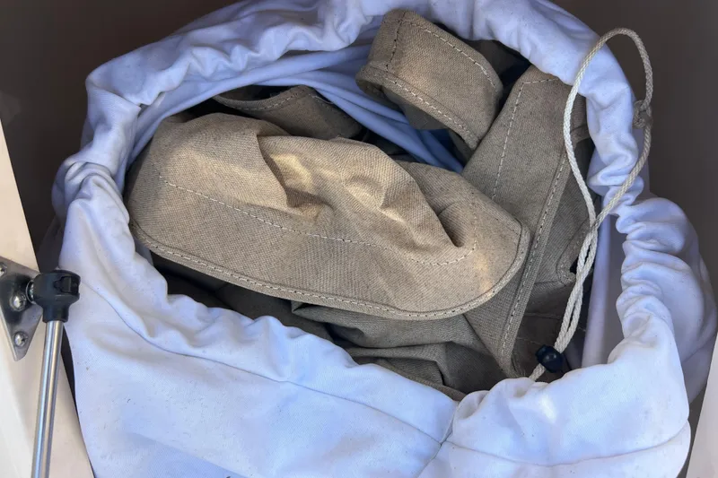 Slide: The Image of Storage compartment with canvas cover on 2019 Scout 275 LXF boat. - 61