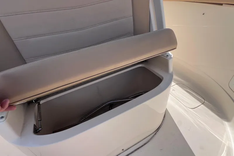 Slide: The Image of 2019 Scout 275 LXF boat seat storage compartment open. - 68