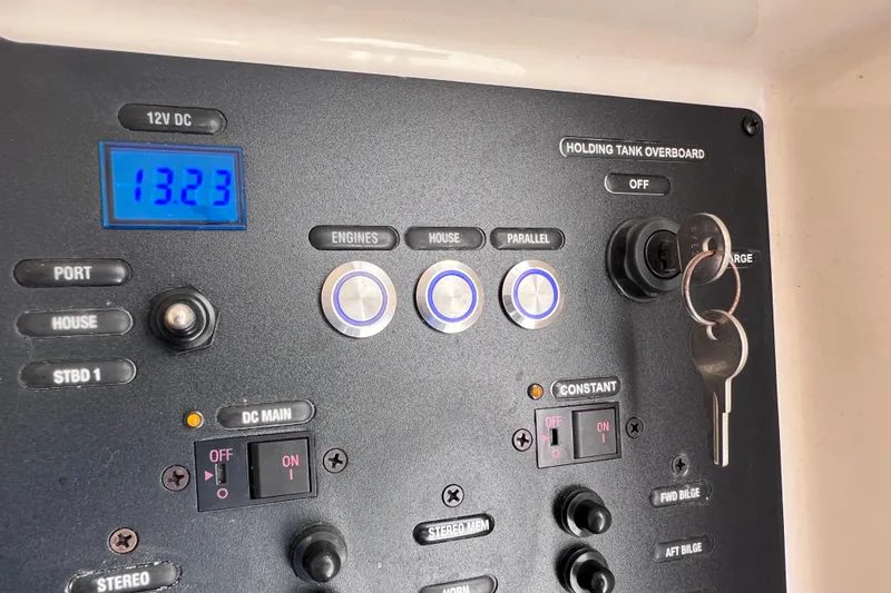 Slide: The Image of Control panel of a 2019 Scout 275 LXF boat with keys and voltage display. - 74