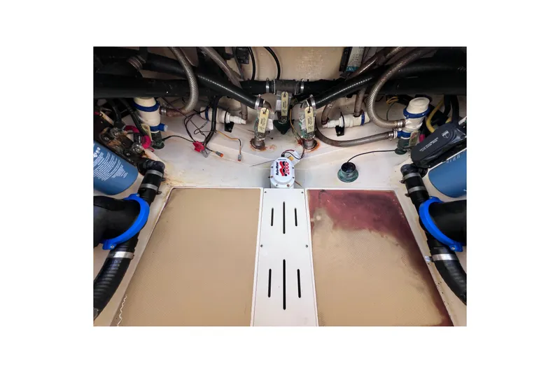 Slide: The Image of Engine compartment of a 2019 Scout 275 LXF boat, showcasing mechanical components. - 81