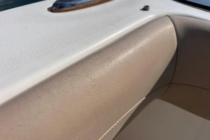 Slide: The Image of Close-up of 2019 Scout 275 LXF boat's beige interior upholstery detail. - 85