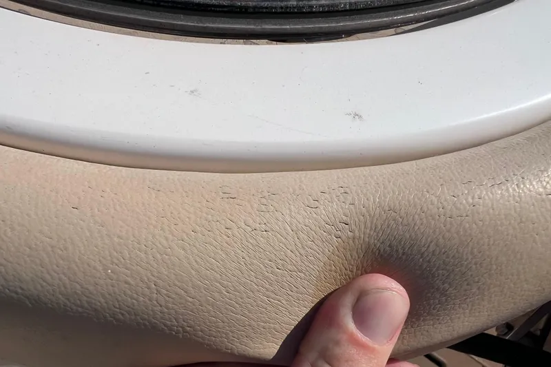 Slide: The Image of Close-up of 2019 Scout 275 LXF boat's worn beige upholstery. - 86