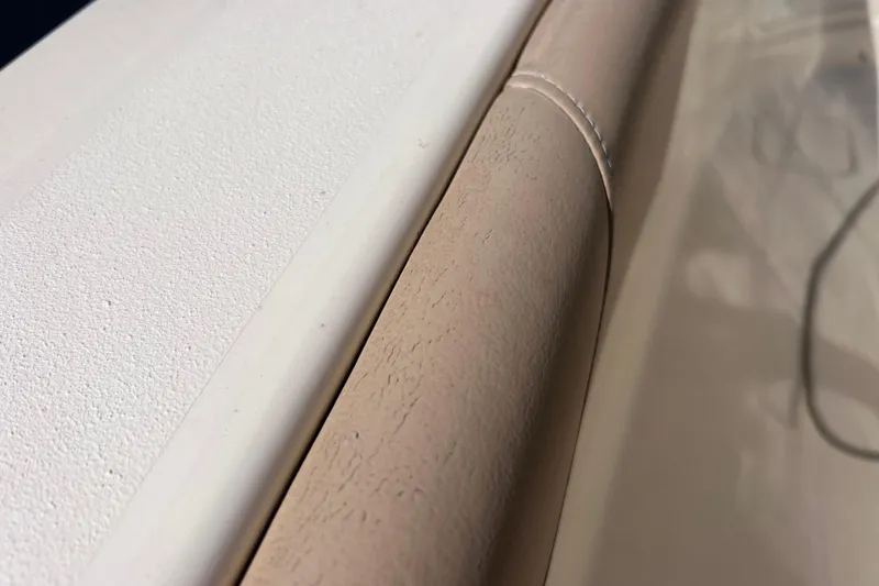 Slide: The Image of Close-up of 2019 Scout 275 LXF boat's textured and stitched interior detail. - 87