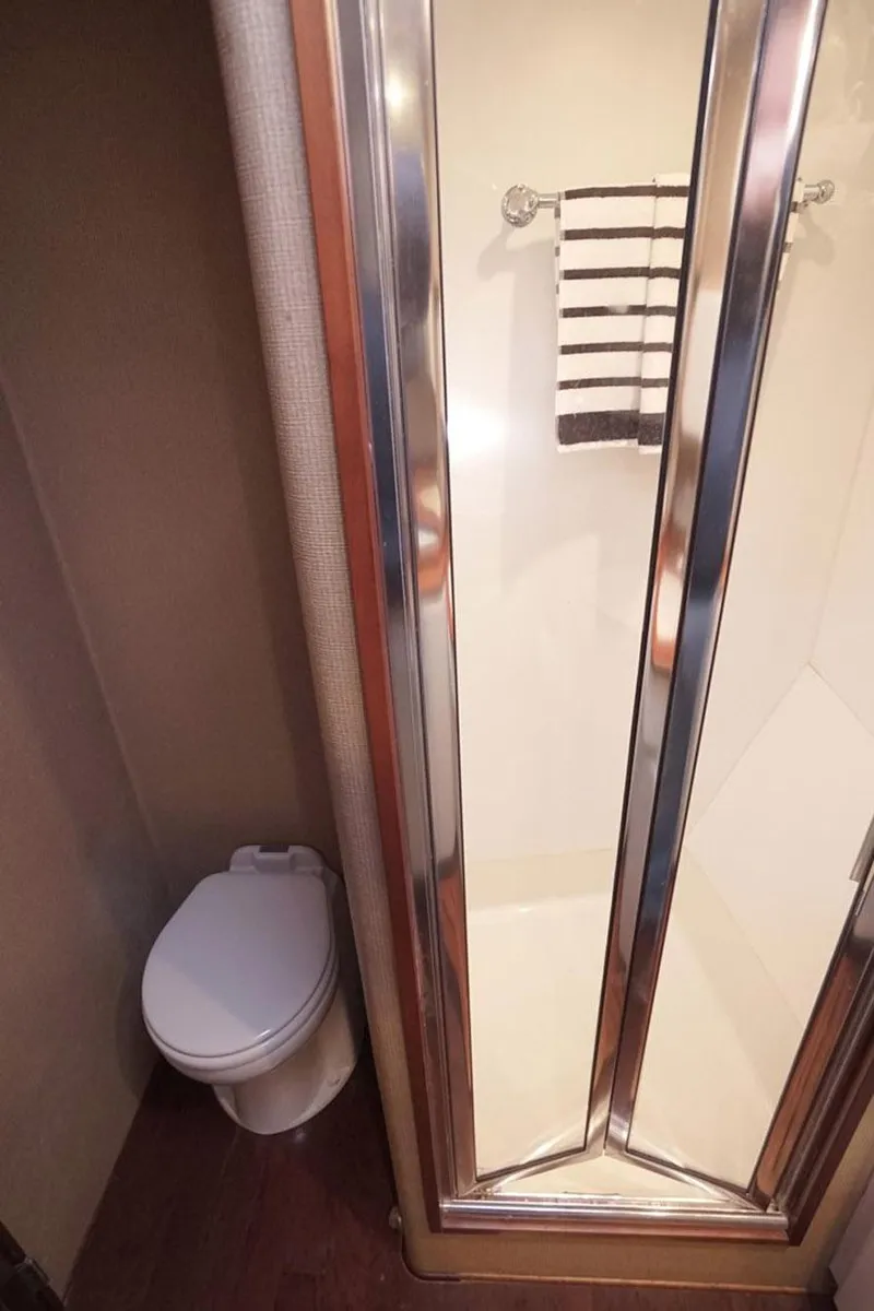 Slide: The Image of Bathroom with shower and toilet in 2003 Huckins 44 Atlantic yacht. - 30