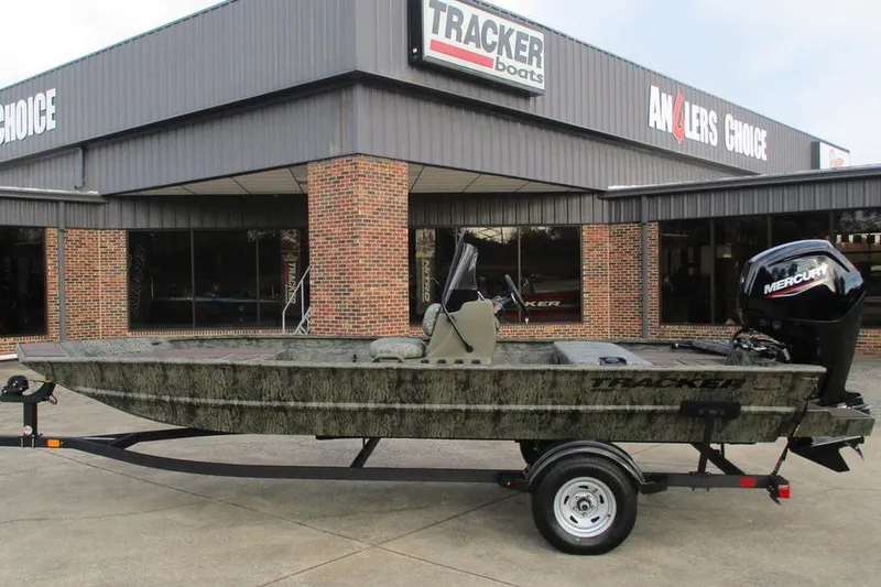 The Image of 2026 Tracker Grizzly 1860 CC boat on trailer outside dealership. - 0