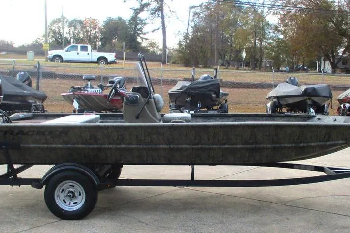 Slide: The Image of 2026 Tracker Grizzly 1860 CC boat on trailer, parked outdoors. - 6