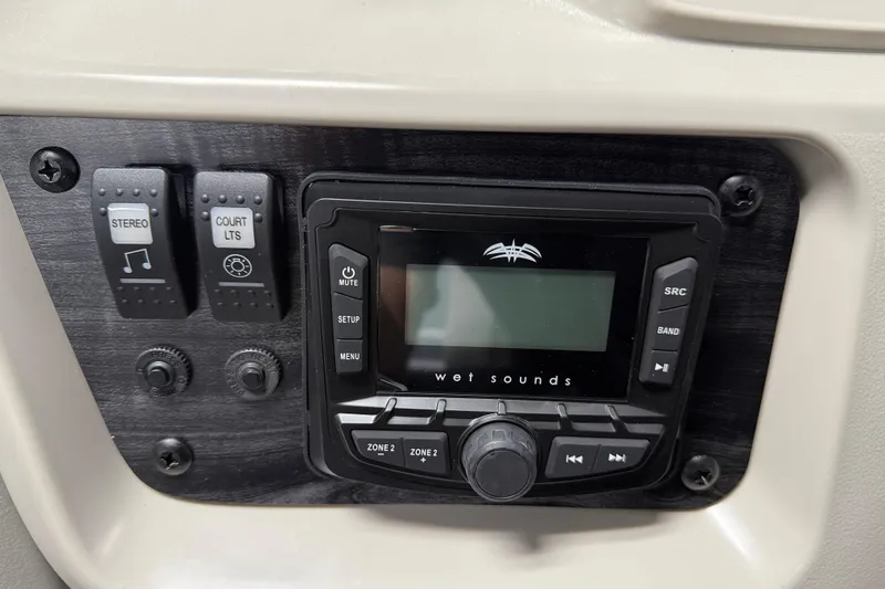 Slide: The Image of Control panel of 2026 SunChaser Vista 18 LR with stereo and lighting switches. - 10