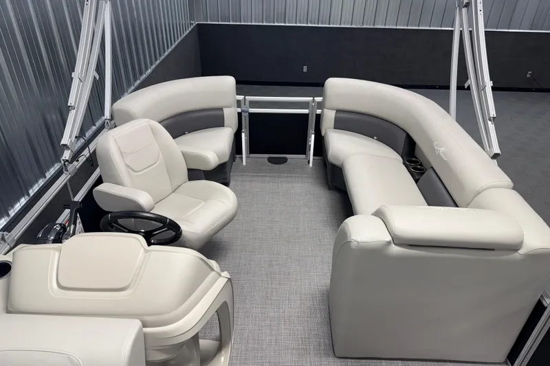Slide: The Image of Interior of 2026 SunChaser Vista 18 LR pontoon boat with plush seating and steering console. - 12