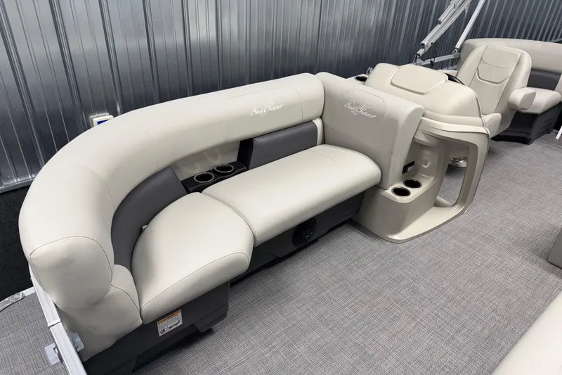Slide: The Image of Luxurious seating on 2026 SunChaser Vista 18 LR pontoon boat, featuring plush upholstery and cup holders. - 15
