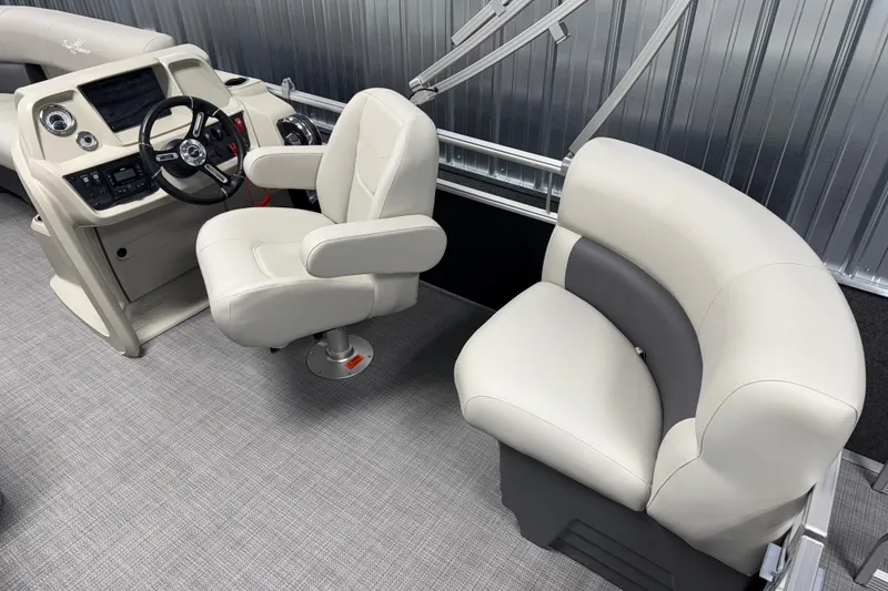 Slide: The Image of 2026 SunChaser Vista 18 LR boat interior with steering console and plush seating. - 3