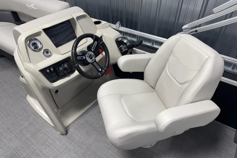 Slide: The Image of Captain's seat and helm of 2026 SunChaser Vista 18 LR boat, featuring modern controls. - 5