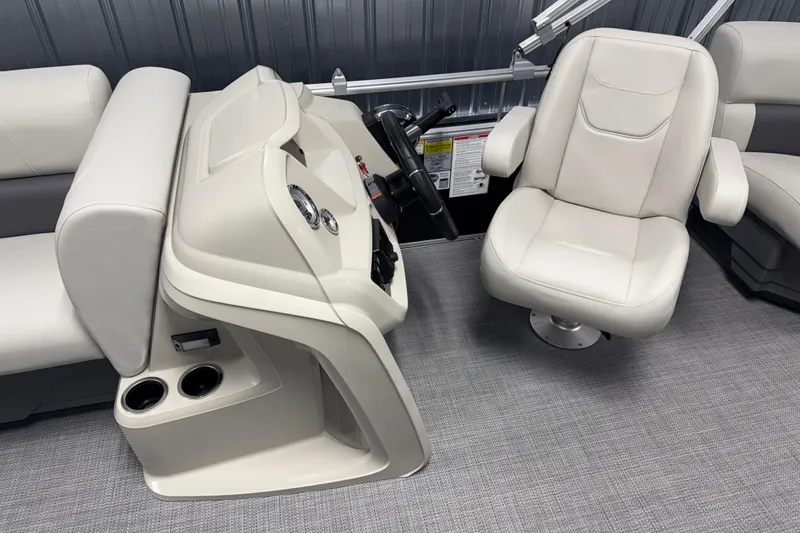 Slide: The Image of 2026 SunChaser Vista 18 LR boat interior with helm and captain's chair. - 6