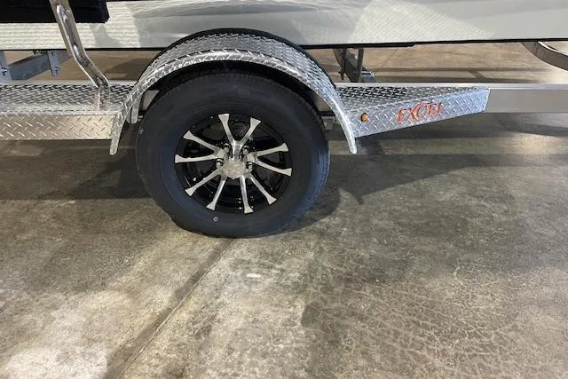 Slide: The Image of Trailer wheel of 2026 Excel EX 183 with diamond plate fender on concrete floor. - 3