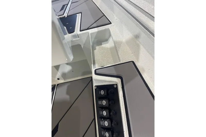 Slide: The Image of 2026 Excel EX 183 boat interior with control panel and sleek design. - 7