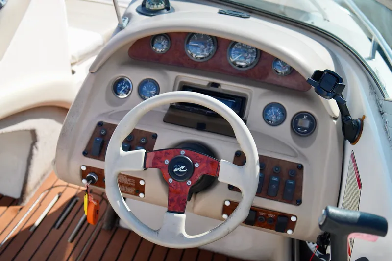 Slide: The Image of Steering wheel and dashboard of a 1995 Sea Ray 200 Bow Rider boat. - 15