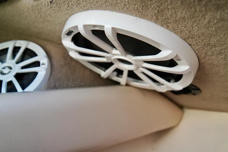 Slide: The Image of White speakers installed in a 1995 Sea Ray 200 Bow Rider boat interior. - 18