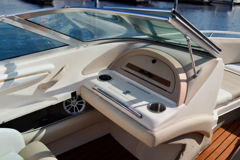 Slide: The Image of Interior of a 1995 Sea Ray 200 Bow Rider boat with seating and cup holders. - 20
