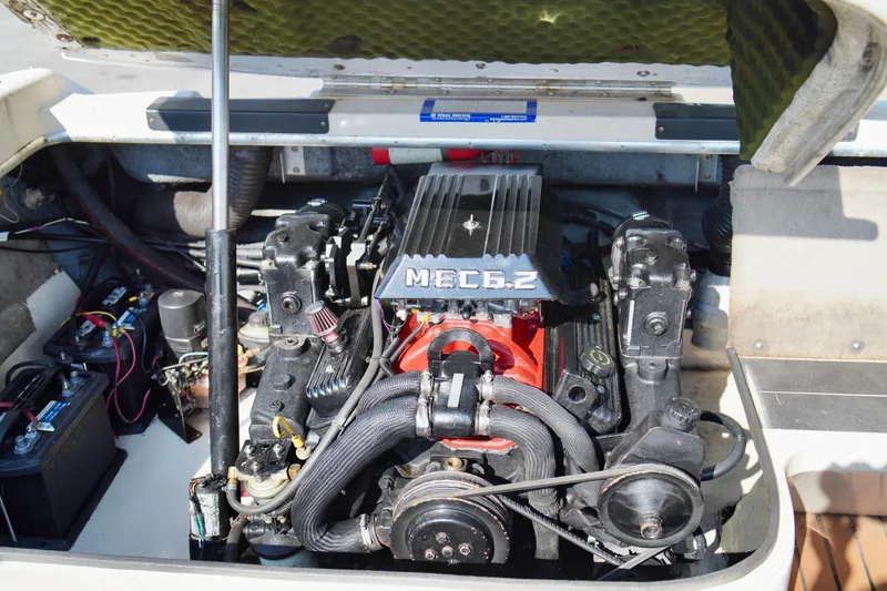 Slide: The Image of Engine compartment of a 1995 Sea Ray 200 Bow Rider boat, featuring a MEC 5.2 engine. - 25