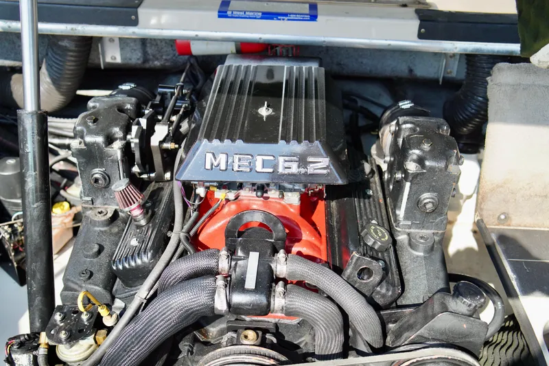 Slide: The Image of Engine of a 1995 Sea Ray 200 Bow Rider boat, featuring a MEC 6.2. - 26