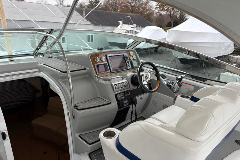 Slide: The Image of 2011 Formula 34 Performance Cruiser cockpit with modern navigation equipment and luxurious seating. - 13