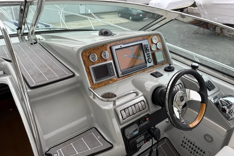 Slide: The Image of 2011 Formula 34 Performance Cruiser helm with navigation system and steering wheel. - 14