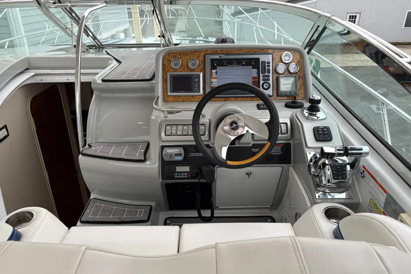 Slide: The Image of Cockpit of 2011 Formula 34 Performance Cruiser with modern navigation controls and steering wheel. - 15