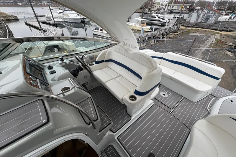 Slide: The Image of 2011 Formula 34 Performance Cruiser interior with white seating and modern dashboard. - 16