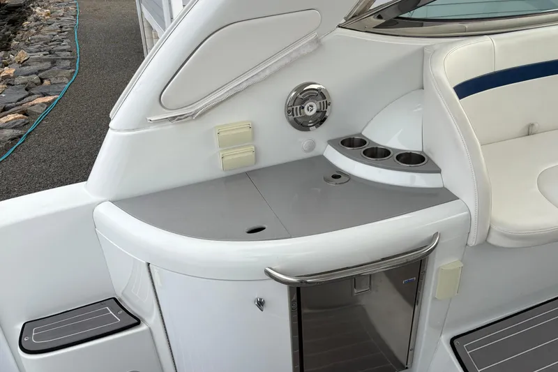 Slide: The Image of 2011 Formula 34 Performance Cruiser interior with seating, cup holders, and mini fridge. - 18