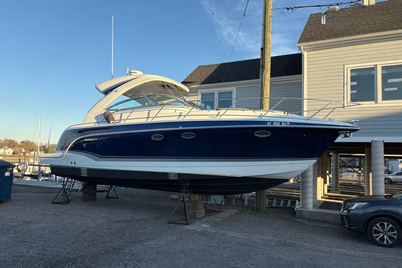 Slide: The Image of 2011 Formula 34 Performance Cruiser boat on dry dock near marina. - 2
