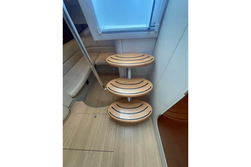 Slide: The Image of Interior of 2011 Formula 34 Performance Cruiser with wooden steps and seating area. - 21