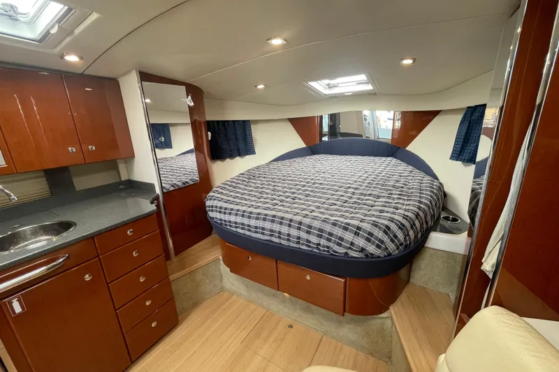 Slide: The Image of Luxurious interior of 2011 Formula 34 Performance Cruiser with cozy bed and wooden cabinetry. - 24