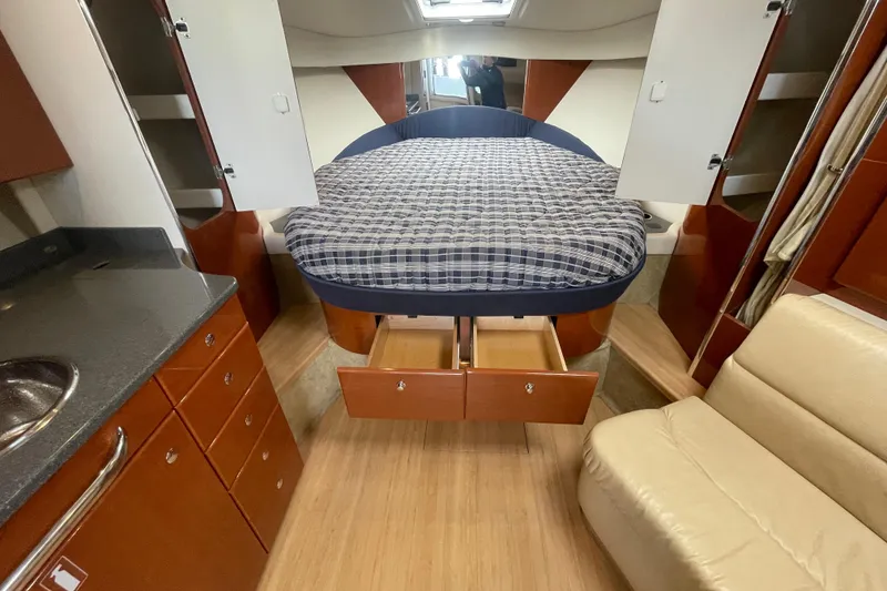 Slide: The Image of 2011 Formula 34 Performance Cruiser interior with bed, storage, and seating. - 26