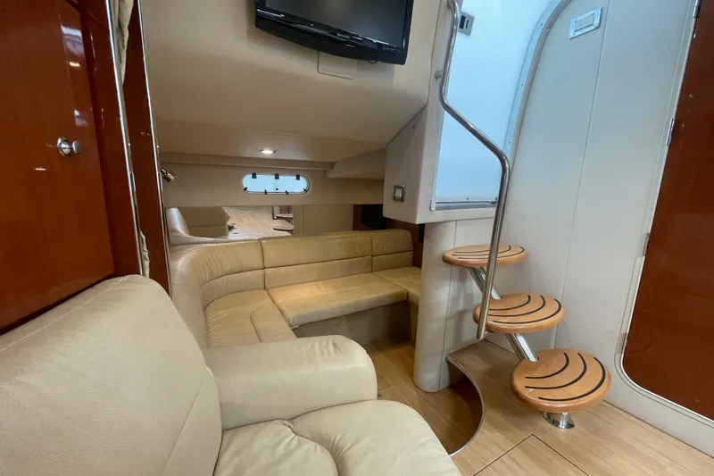 Slide: The Image of Interior of 2011 Formula 34 Performance Cruiser with beige seating and wooden steps. - 29