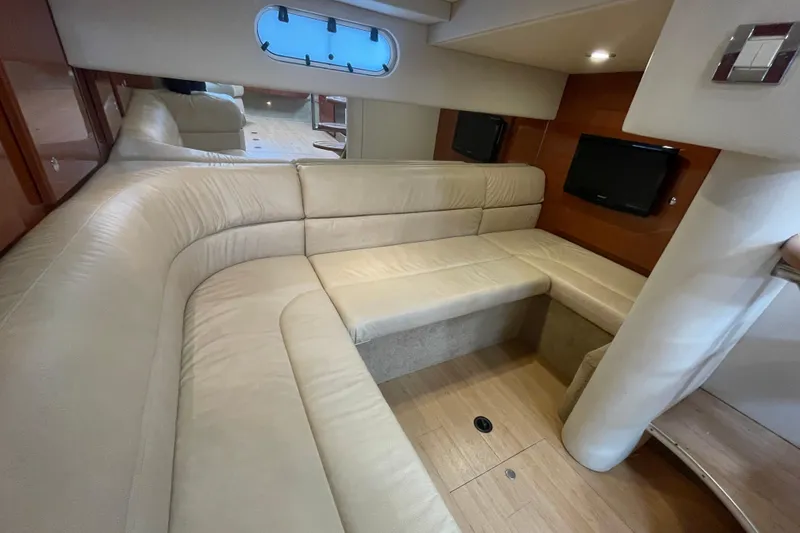 Slide: The Image of Luxurious interior of 2011 Formula 34 Performance Cruiser with beige seating and wood accents. - 30