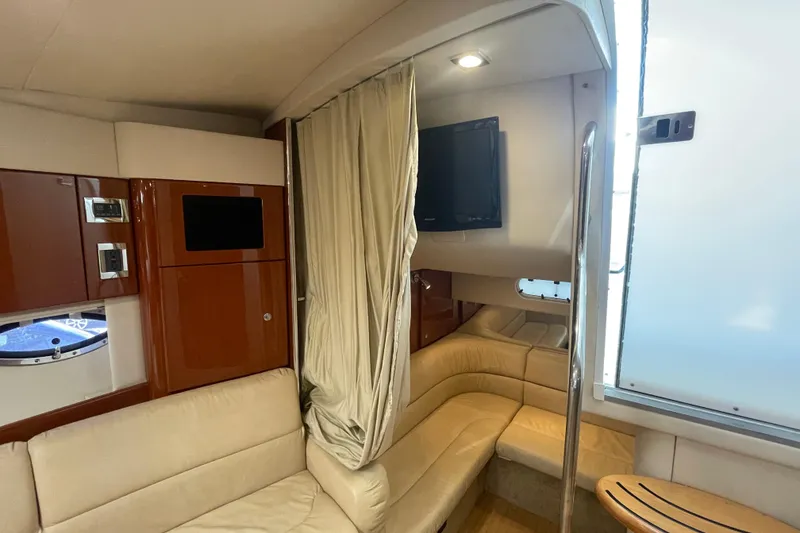 Slide: The Image of Interior of 2011 Formula 34 Performance Cruiser with beige seating and wood accents. - 33