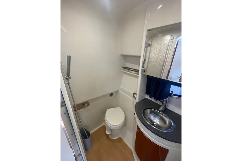 Slide: The Image of 2011 Formula 34 Performance Cruiser bathroom with toilet, sink, and shower. - 41