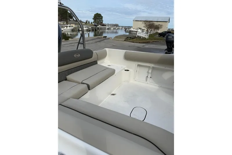 Slide: The Image of 2026 Key West 203 DFS boat interior with seating and cup holders. - 2