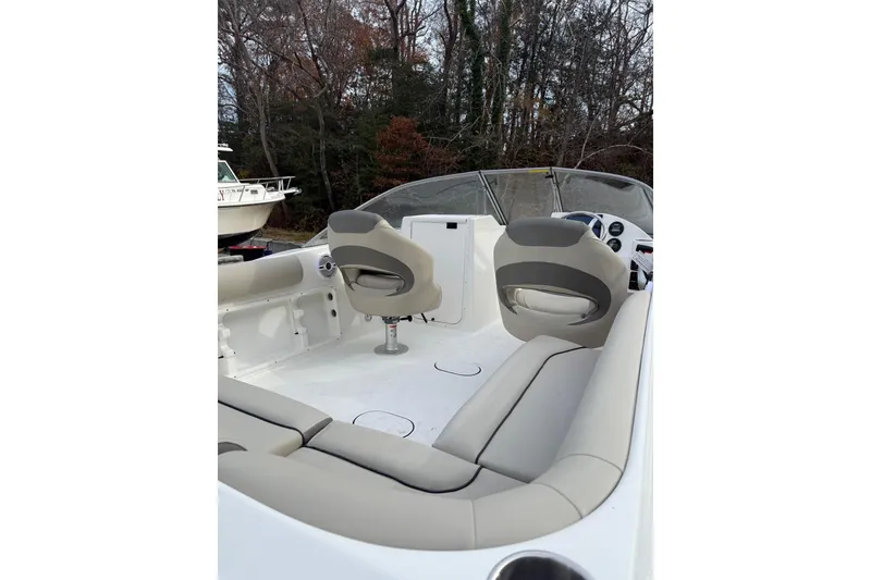 Slide: The Image of 2026 Key West 203 DFS boat dashboard with steering wheel and controls. - 5