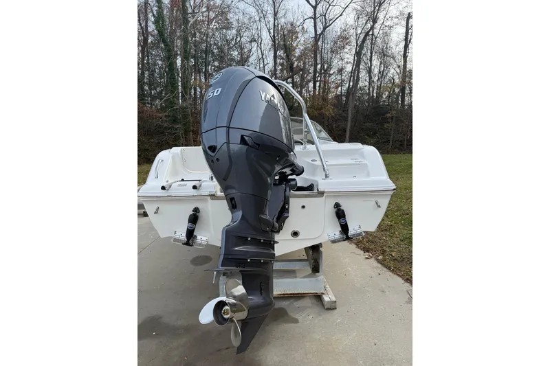 Slide: The Image of 2026 Key West 203 DFS boat interior with plush seating and steering wheel. - 7