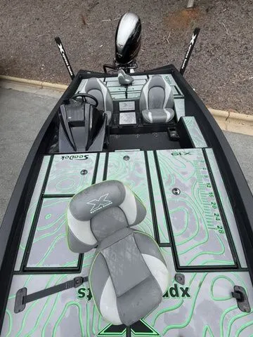 Slide: The Image of 2023 Xpress Boats X19 PRO with stylish seating and modern design. - 11
