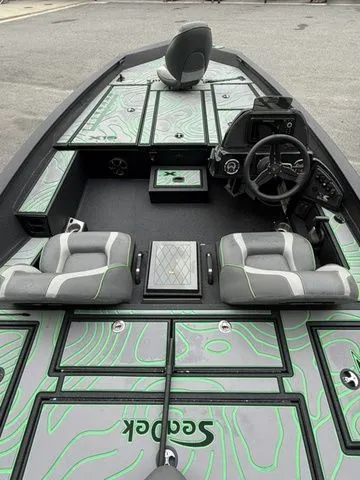 Slide: The Image of 2023 Xpress Boats X19 PRO interior with stylish seating and modern dashboard. - 4