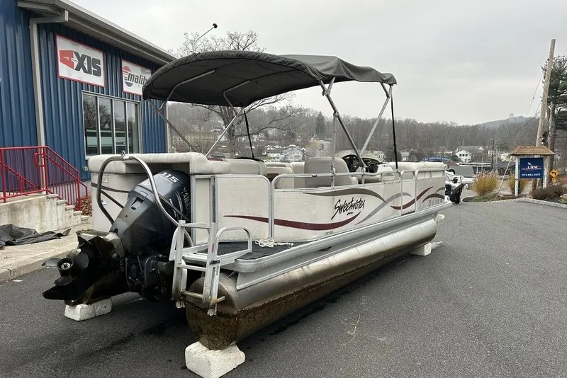 Slide: The Image of 2003 Sweetwater 2221 SC pontoon boat with Yamaha motor, parked outside dealership. - 1