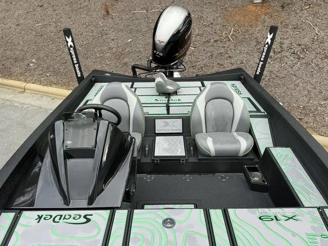 Slide: The Image of 2023 Xpress Boats X19 PRO interior with dual seats and modern dashboard. - 12