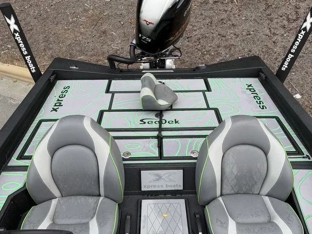 Slide: The Image of 2023 Xpress Boats X19 PRO interior with SeaDek flooring and Yamaha engine. - 13