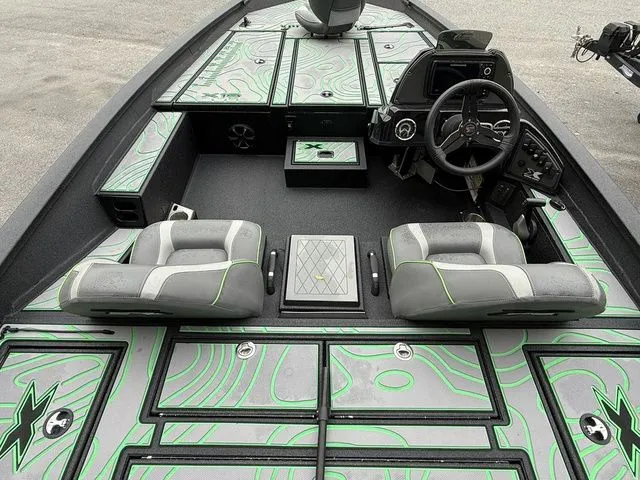 Slide: The Image of 2023 Xpress Boats X19 PRO interior with stylish seating and modern dashboard design. - 5